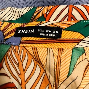Three piece tropical set from SHEIN: button down blouse, tube top & shorts.